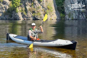 Neris Folding kayak fully unpacked and inflated, with a rudder system and a spray deck installed on it for full protection. The spray deck isn't needed in calm water, but is really handy in rough sea waters 